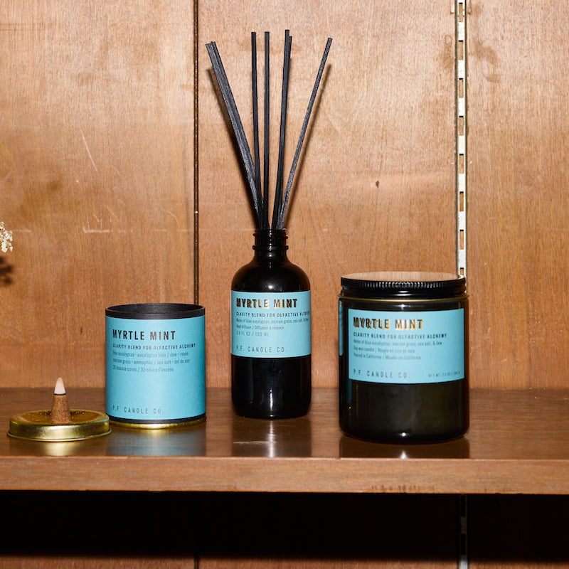 P.F. Candle Co. Myrtle Mint - Scent Family - Alchemy is a collection of candles, incense cones, and reed diffusers featuring science-backed blends meant to mimic the healing qualities of nature and boost your mood.