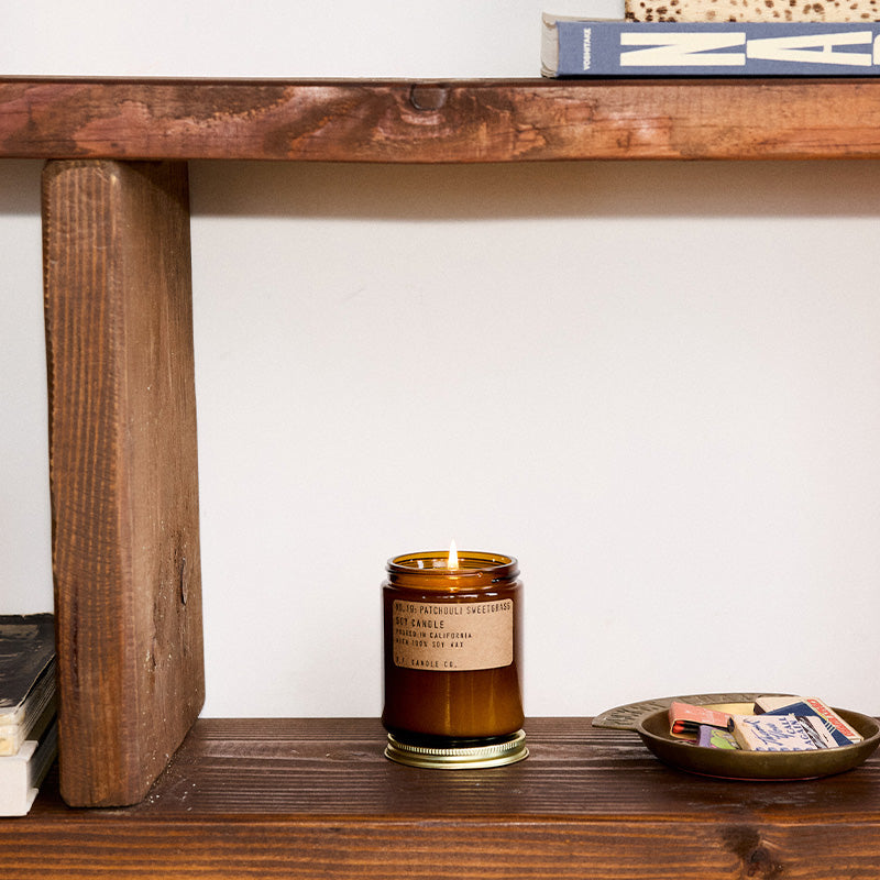 P.F. Candle Co. Patchouli Sweetgrass Standard Candle - Lifestyle - A windows-open, incense-burning Saturday with nowhere to be. Cream, sweetgrass, and smoke.